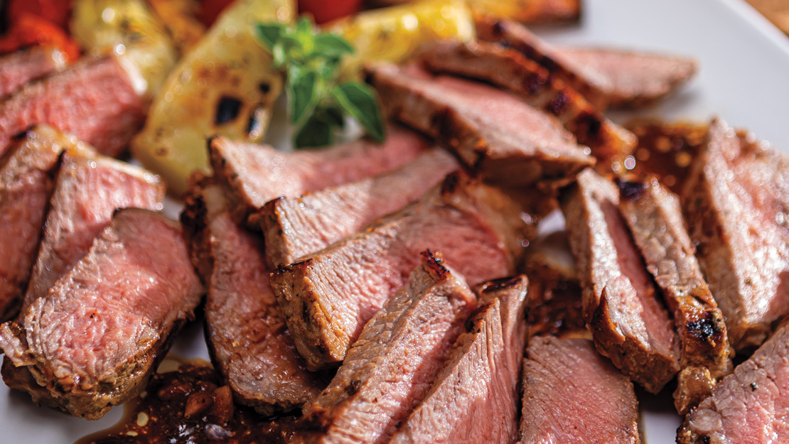 Greek Sheet-Pan KC Strip Steak with Roasted Tomatoes, Artichokes & Fingerlings